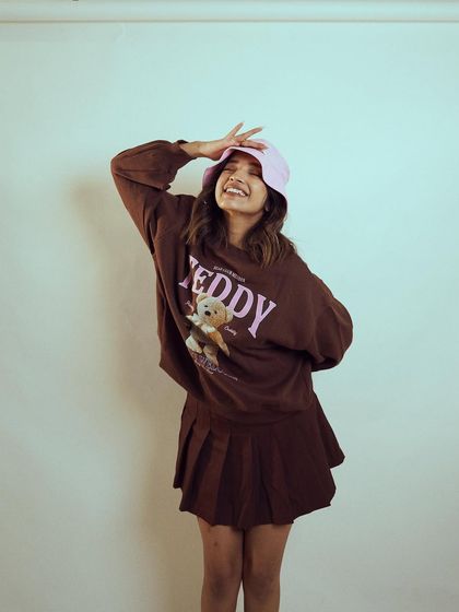 A happy and candid shot of Diksha Rawat. Her genuine smile brings a sense of fun and relatability to the fashion shoot.