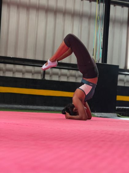 Holding a tuck headstand is a great exercise for building the core strength needed for more advanced inversions.