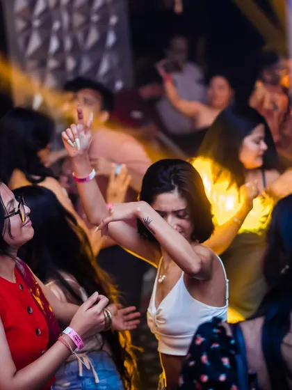 A guest completely lost in the music on the dance floor. This is the kind of uninhibited energy I aim to create with my high-energy house and pop sets.