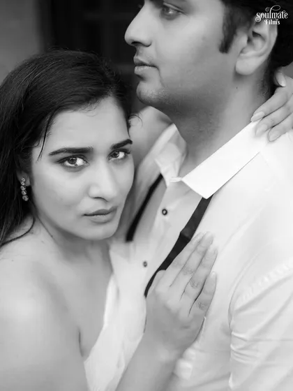 An intense and intimate black and white close-up. Her direct gaze into the camera creates a powerful and confident portrait, showcasing a more dramatic and soulful side of pre-wedding photography.