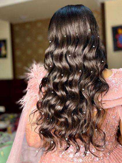 Ethereal elegance for a reception. These long, flowing waves are dotted with pearls for a starry night effect.