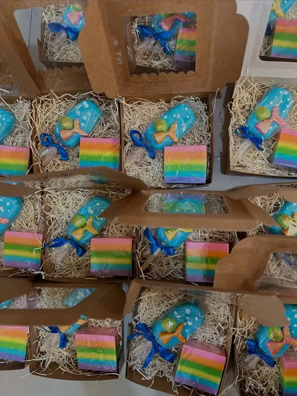 A magical combination of a mermaid popsicle soap and a vibrant rainbow soap, packed and ready for a birthday party.