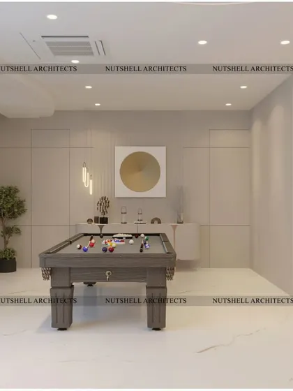 A simple yet refined billiards room, perfect for a quiet game. The space is kept bright and open with a neutral color palette, allowing the pool table to be the main focus.