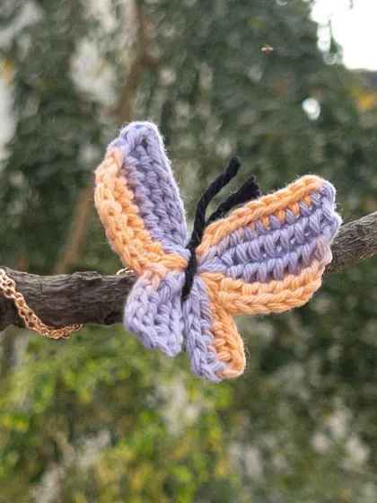 The 'Titli' necklace in a dreamy peach and lilac. This is such a soft and pretty color combination.