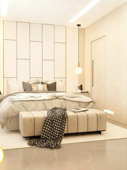 Another view of the white and gold bedroom, showing the full-length mirror that enhances the room's brightness and sense of space.