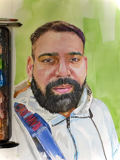 A watercolor portrait of a man against a simple green background. The focus here is entirely on the face, capturing a direct and engaging expression with fluid brushstrokes.