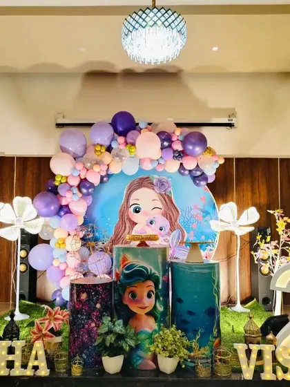 Another full view of the mermaid party, highlighting the balloon colors and character backdrop.
