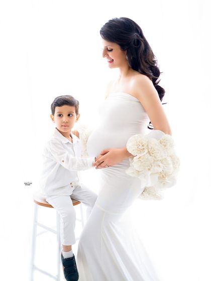 A beautiful high-key shot of a mamma and her son. The all-white outfits create such a pure and angelic look.