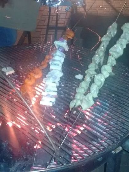 A closer look at our live barbecue station. We use traditional methods to grill our kebabs, ensuring an authentic smoky flavor that your guests will love.