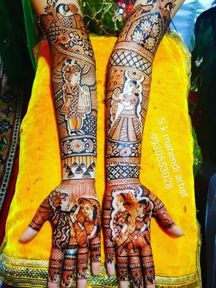 This design is filled with multiple portraits and figures. It shows the couple's wedding ceremony along with depictions of Radha and Krishna.