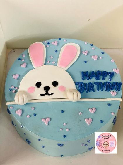 An adorable "honey bunny" cake in a lovely shade of blue.