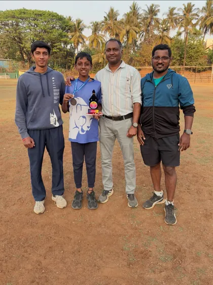 Our Under-12 athlete with his coaches after winning a bronze medal in the 60m sprint at the State Level Meet.