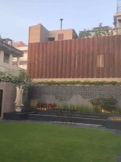 Vertical wooden cladding used to create a feature wall and provide privacy. This is a great way to add texture and a natural element to an urban garden.