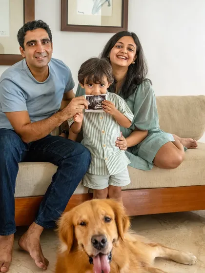 The whole family is here! Announcing a new baby on the way, with big brother Ziggy the Golden Retriever front and center. This is what family is all about, capturing everyone together, celebrating a huge milestone with smiles, love, and a happy pup.