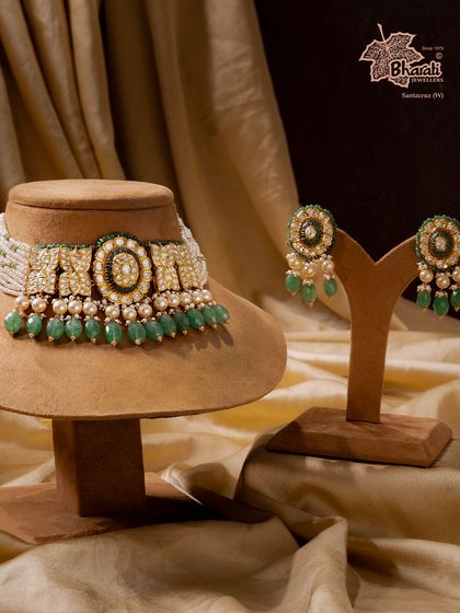 Our Moissanite Mirage choker, designed for the modern bride. Dazzling moissanite gems are paired with the regal calm of emeralds and pearls, creating a fusion of light and legacy in 22ct gold.