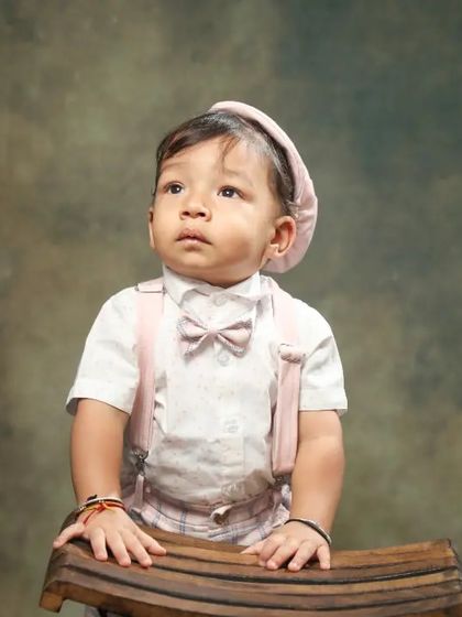 This little gentleman is looking off into the distance. I wonder what he's thinking about. A beautiful, classic toddler portrait.