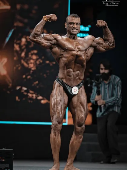 Another angle of the front double biceps. Notice the detail in the arms, chest, and abs. This is the level of conditioning we aim for.