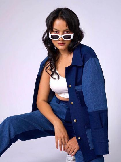 A final shot of the denim look, proving that simple, clean makeup is the perfect complement to a strong fashion statement.