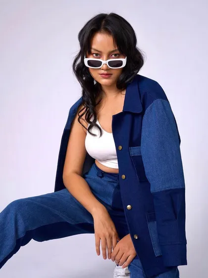 A cool denim-on-denim look for Raki Designs. The makeup is minimal and fresh, with a focus on clean skin.