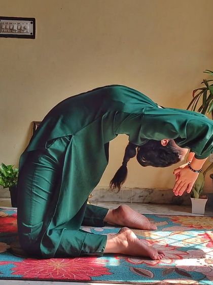 A deep Ustrasana (Camel Pose). Backbends are not just physical postures; they are acts of vulnerability and courage, opening our hearts to the world.
