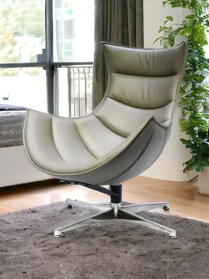 This imported lounge chair has a unique, futuristic design with a curved, shell-like body. It's a true statement piece that offers surprising comfort.