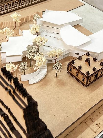 An overhead view of the complete architectural site model, showing the relationship between the buildings and the landscape.