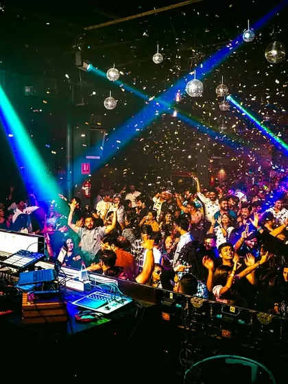 The crowd going wild under a shower of confetti at Chayageet Night. These are the moments that make themed parties special.