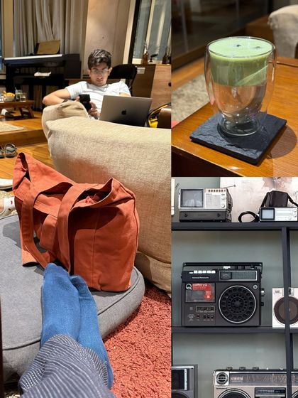A cozy scene from a cafe, showing a relaxed atmosphere with vintage radios on a shelf and a glass of matcha latte.