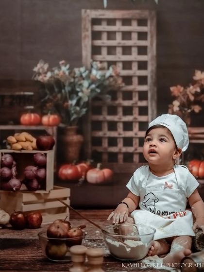 A moment of curiosity from our cute chef. The rustic backdrop and warm lighting give these photos a cozy, storybook feel that families love.