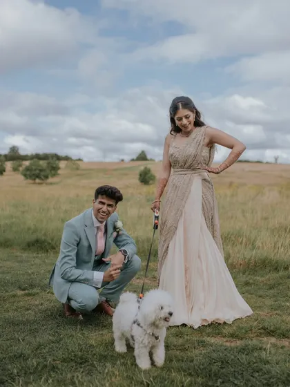 A fun and relaxed portrait of the couple with their adorable dog. This image shows our ability to capture natural and joyful moments during the couple's portrait session.