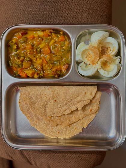 A simple yet effective high-protein meal of chapati, mixed vegetable curry, and boiled egg whites.