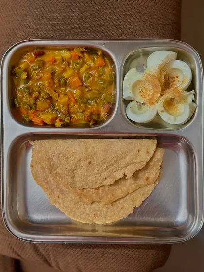 A simple meal of chapati, mixed vegetable curry, and boiled egg whites. This is a quick and easy way to get a balanced meal with adequate protein.