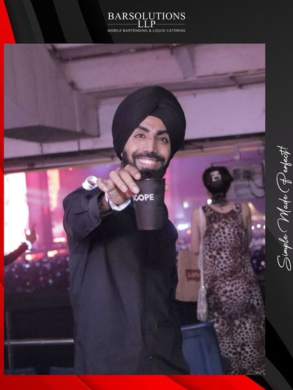 A happy fan enjoying a drink at the Diljit Dosanjh concert. Our goal is to ensure every guest has a great experience.