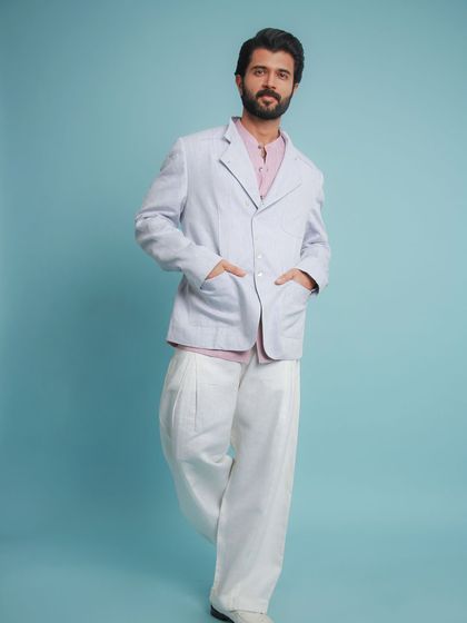 The full outfit, featuring wide-leg linen trousers. It’s a relaxed, breathable look that’s perfect for warm weather events.