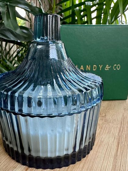 A close-up of the beautiful blue ribbed glass container for my vanilla candle. The quality of the vessel is just as important as the candle inside.