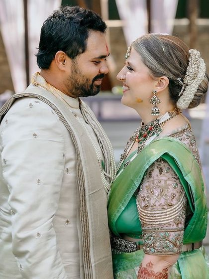 A couple shares a look during their ceremony, their joy and love for each other lighting up the frame.
