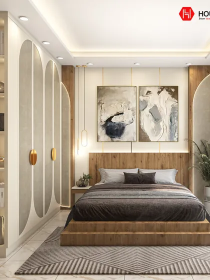 This master bedroom is a testament to modern elegance, blending warm wood tones with textured wall panels and refined decor. We designed this space to be a personal sanctuary, balancing sophisticated aesthetics with functional elements like integrated storage and ambient lighting for a restful ambiance.