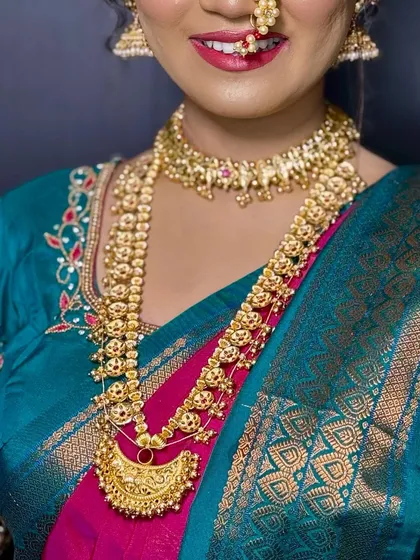 A close-up of the jewellery and the smile. A happy bride is the most beautiful bride.