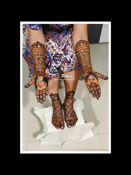 The complete bridal look for a gorgeous Gujarati bride, with full mehendi on both hands and feet. The design is cohesive, carrying themes from the arms down to the toes.