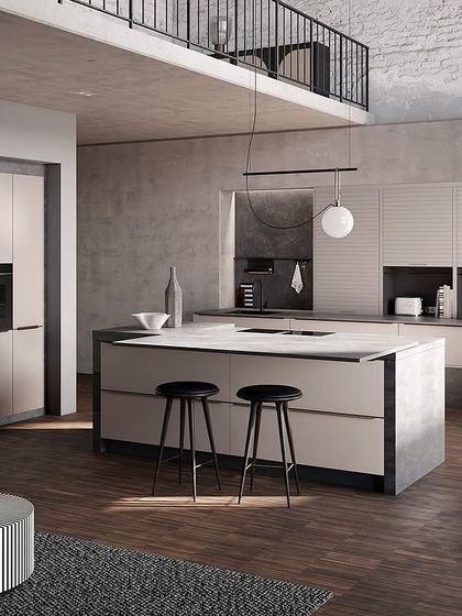 A swipeable image showing how a kitchen can be transformed with color. This version features soft, neutral beige-grey cabinets for a calm and sophisticated look.