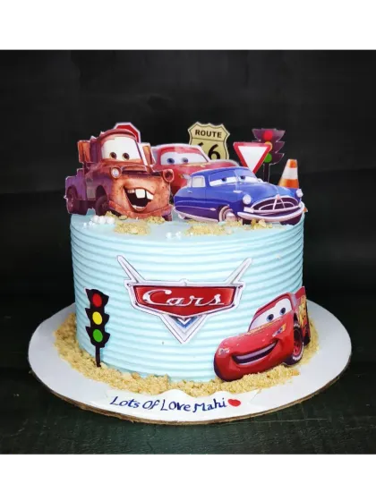 Kachow! Here is another take on the popular Cars theme. This eggless choco-vanilla cake is decorated with a textured road and all the main characters, ready to race.