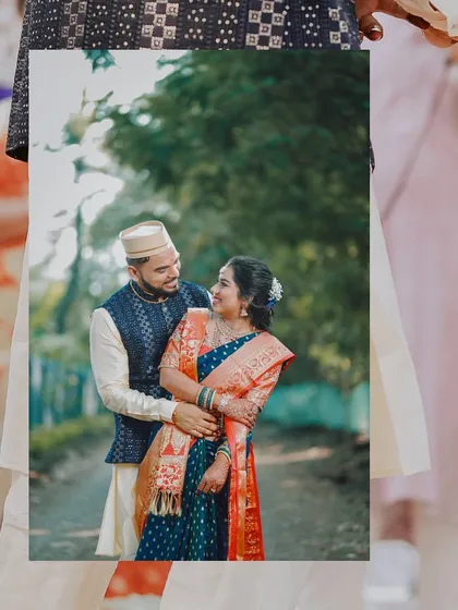 A beautiful portrait of an engaged couple in traditional Maharashtrian attire, looking at each other with love.