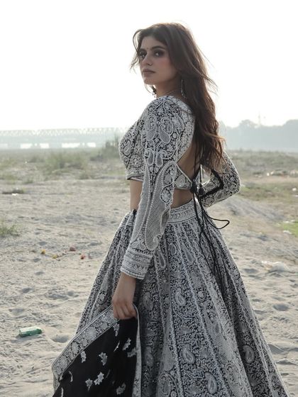 A moody, atmospheric shot of this unique lehenga, highlighting its modern yet timeless appeal.