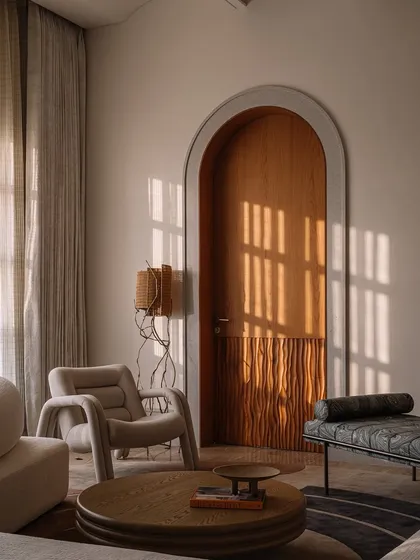 Our 'Hide N Seek' screen is furniture that invites play. Designed to divide a large suite into a salon and bedroom, its amoebic wooden panels have organic cutouts that frame views and create intriguing vignettes. It’s a sculptural piece that is both a space divider and an interactive art form.