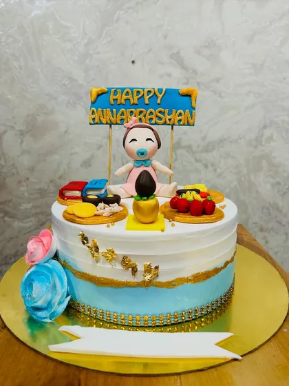 Another beautiful Annaprashan cake, this one for a baby girl, featuring all the traditional elements for the ceremony.