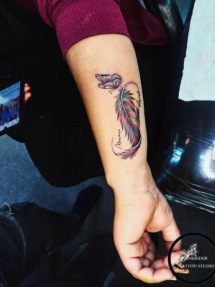 A beautiful combination of a colorful feather and a butterfly. This design symbolizes transformation, freedom, and beauty.
