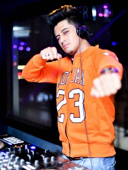 A typical action shot from the DJ booth. My energy behind the decks matches the energy of the music I play.