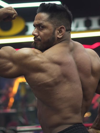 The only shortcut is consistent hard work. A back and bicep pose.