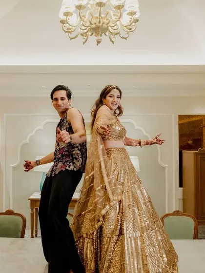 Back to back and ready to party! This fun pose captures the couple's playful dynamic.