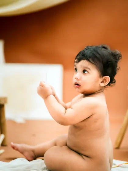 Looking up with wide-eyed wonder. These simple, unposed moments are often the most beautiful.